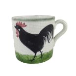 A LLANELLY POTTERY MUG painted with single black cock strutting on grass, stencilled LLANELLY to