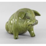 EWENNY POTTERY MODEL OF A SEATED PIG titled to the back 'Y Mochyn Bach' inscribed to the base '