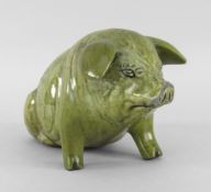 EWENNY POTTERY MODEL OF A SEATED PIG titled to the back 'Y Mochyn Bach' inscribed to the base '