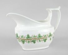 SWANSEA PORCELAIN MILK JUG of oval form with wide elongated spout and spurred straight-top loop
