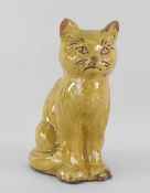 EWENNY POTTERY MODEL OF A SEATED CAT in mustard glaze, incised decoration, untitled, inscribed to