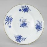 NANTGARW PORCELAIN CIRCULAR PLATE painted in blue with sprays of flowers and with gilt rim,