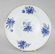 NANTGARW PORCELAIN CIRCULAR PLATE painted in blue with sprays of flowers and with gilt rim,