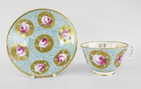 A SWANSEA PORCELAIN CUP & SAUCER decorated with a gold oeil-de-perdrix on a turquoise ground and