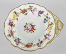 A NANTGARW PORCELAIN SHELL SHAPED DISH decorated with a continuous band of flowers to the border and