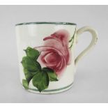 A LLANELLY POTTERY MUG painted with single tea-rose on branch with leaves, stencilled Llanelly to