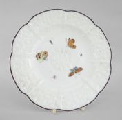 A NANTGARW PORCELAIN CRUCIFORM PLATE WITH DAISY MOULDING decorated with insects within the chocolate