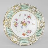 NANTGARW PORCELAIN PLATE having an oeil de perdrix border between gilded moulding of ribbons,