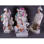 FOUR STAFFORDSHIRE FLATBACK FIGURINES including Tom king on horseback, Lion Slayer ETC