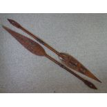 AFRICAN CARVED PADDLE SPEARS, a pair, 164cms approximate length