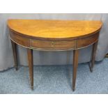 HALF MOON MAHOGANY FOLD-OVER TEA TABLE, circa 1860 with single central drawer on tapering supports