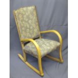 VINTAGE STYLE LIGHTWOOD ROCKING ARMCHAIR with studded edge upholstery to the back, 87cms H, 54.