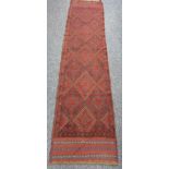MESHWANI RUNNER - red and blue ground, single bordered with multi-diamond central block, 260 x