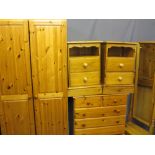 FOUR ITEMS OF MODERN PINE BEDROOM FURNITURE including a two door wardrobe, 188cms H, 81cms W, 52.