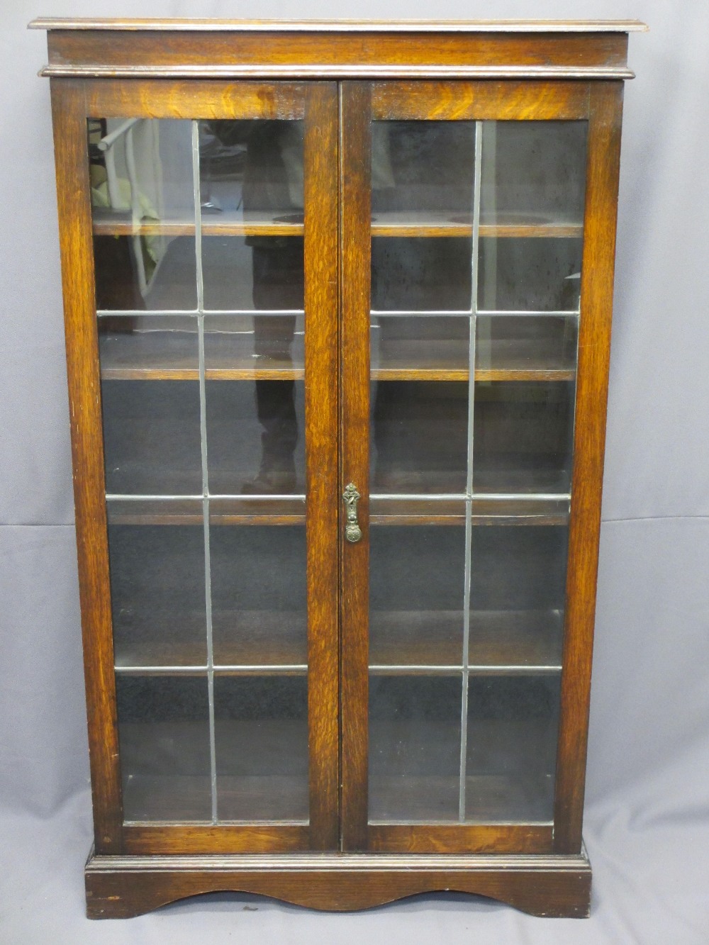 VINTAGE OAK BOOKCASE with twin leaded glass doors and fixed interior shelves, 135cms H, 81cms W,