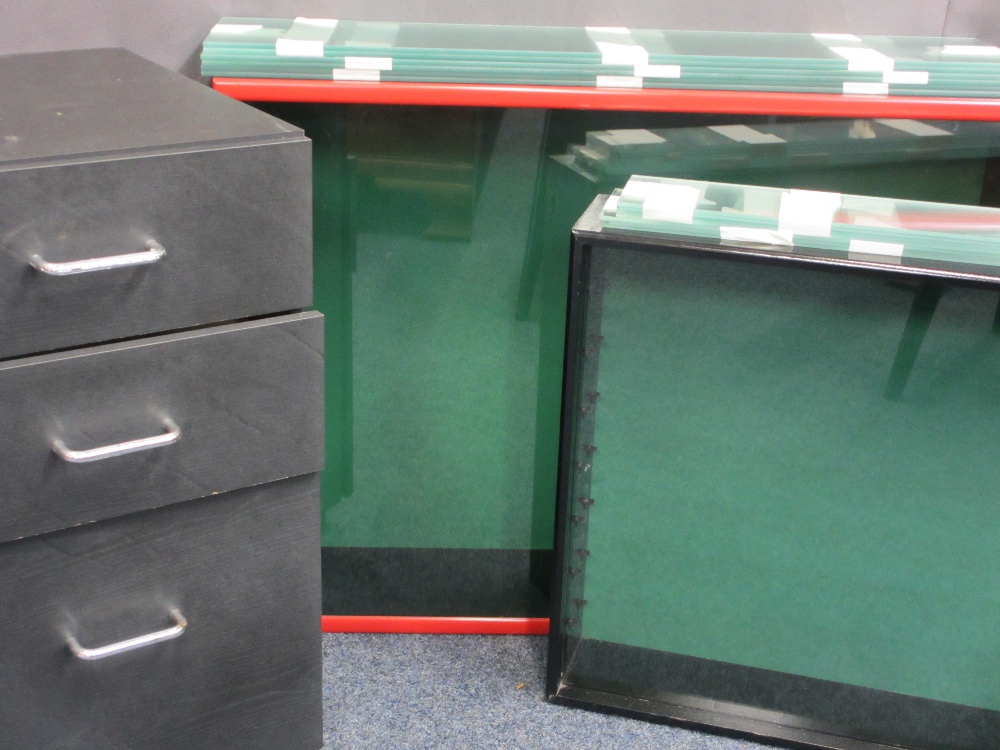 TWO MODERN WALL MOUNT DISPLAY CASES with glass shelving and a three drawer wheeled office chest,