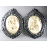 BASS RELIEF PLAQUES, a pair with convex glass over biblical studies. In the style of E.Cassier,