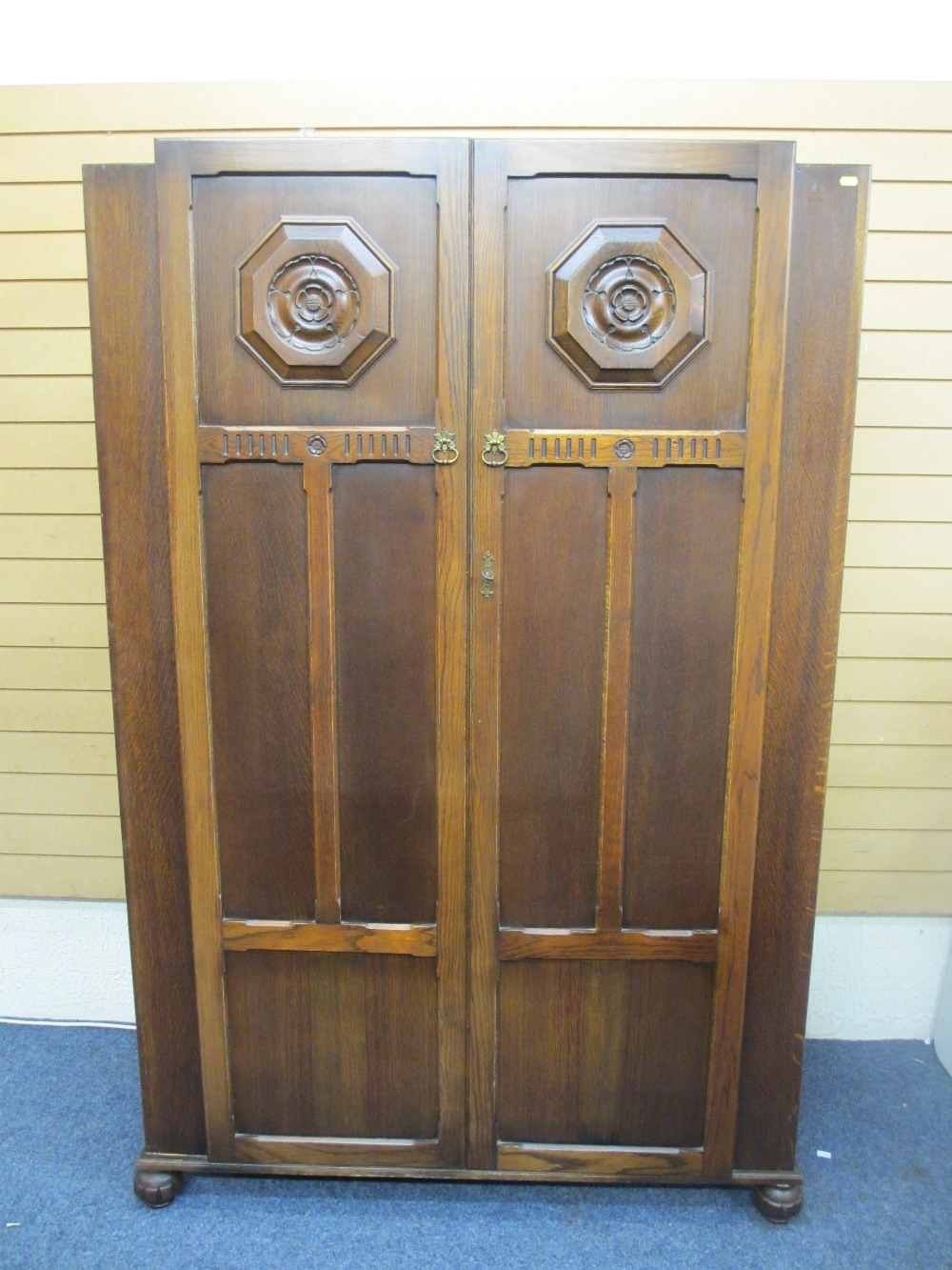 VINTAGE OAK TWO DOOR WARDROBE with English Rose carved roundels, 188cms H, 121cms W, 57cms D