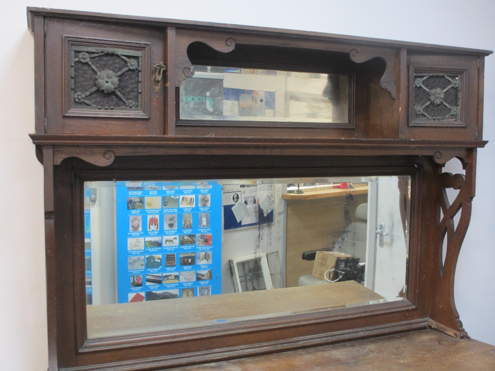 OAK MIRROR BACK SIDEBOARD, circa 1900, having twin cupboard top with central mirrored shelf over a - Image 2 of 3