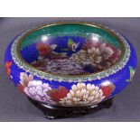 20TH CENTURY CLOISONNE ENAMEL BOWL on hardwood stand, blue ground with large floral sprays and