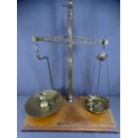 SHOPKEEPER'S OLD BALANCE SCALES with weights on a wooden base