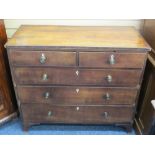 CROSSBANDED MAHOGANY CHEST of two short over three long drawers having Regency brass knobs and ivory