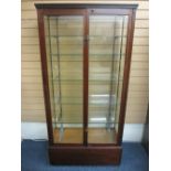 VICTORIAN MAHOGANY SHOP DISPLAY CABINET, glazed all round with cast support bars and glass shelving,