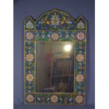 PERSIAN STYLE WALL MIRROR with reverse glass painting of floral sprays to the frame, 59 x 38cms