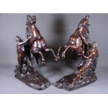 AFTER COUSTOU BRONZE MARLEY HORSES, a pair with attendants on rocky platform bases, 44cms H, 33cms