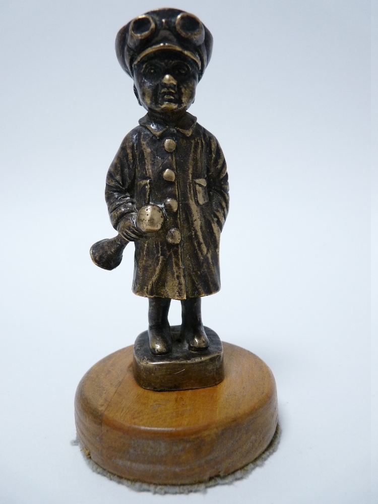 VINTAGE CAR MASCOT- STANDING CHAUFFER wearing cap and goggles, holding a horn, circa 1920s, 9cms H.