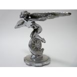 VINTAGE CAR MASCOT - WINGED FEMALE RIDING A WHEEL by A E Lejeune, REG/DES 686123, 14.5cms H, 23.5cms