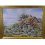 GEORGE H HUGHES. Watercolour-thatched cottage with lady in floral bedecked garden, signed, 34x47