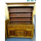 WELSH DRESSER-MAHOGANY, OAK AND PINE with a 3-shelf rack over 3 centre opening drawers, a false base