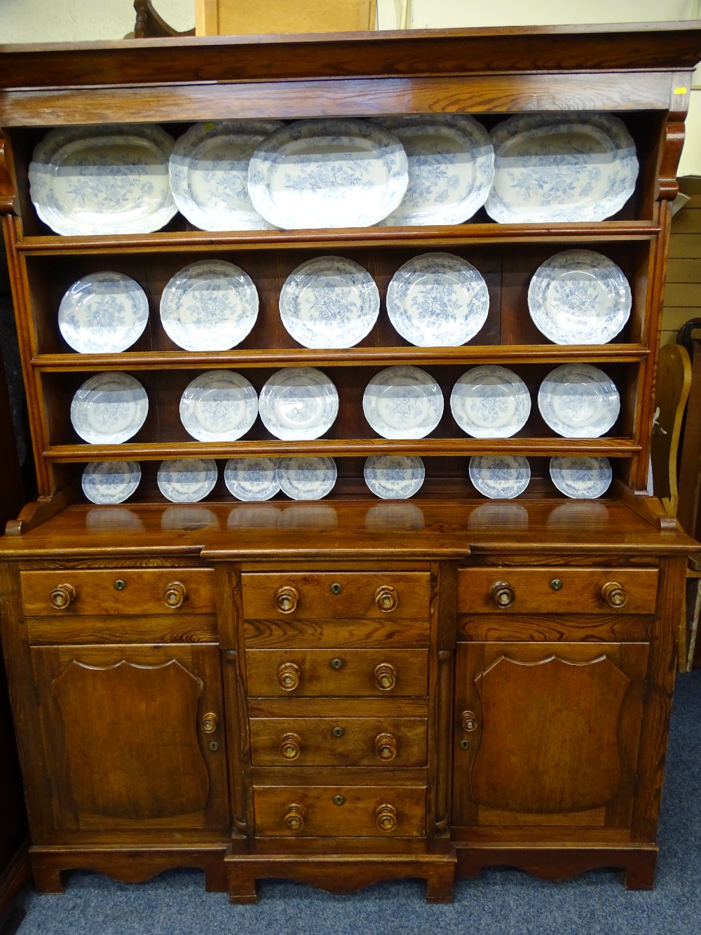 WELSH DRESSER. LATE 9TH CENTURY PINE AND MAHOGANY with 3-shelf rack over a breakfront base of 3 open