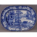 BLUE AND WHITE TURKEY PLATTER- 2 Romanesque figures on a plinth with 2 drovers and cattle by a river