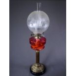 OIL LAMP on brass Corinthian column with cranberry glass reservoir and etched shade