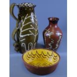 A LARGE SLIPWARE JUG WITH DOUBLE HANDLES 31cms high, a similar bowl and a studio pottery vase