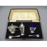 SILVER 3-PIECE CASED CONDIMENT set with pair of spoons, 3 ounces Birmingham 1930