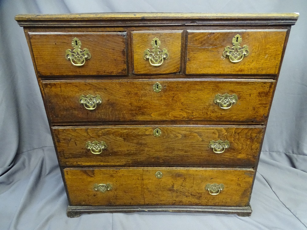 AN ANTIQUE OAK CHEST of 3 long and 2 short drawers with centre box drawer, 92 cms wide, 90 cms