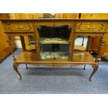 AN EDWARDIAN MAHOGANY BASE OF A SIDEBOARD CABINET, centre shaped glass door with end open shelves,