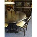 A DINING SUITE - dark wood rustic comprising buffet cupboard and drop leaf dining table with 4
