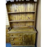 RUSTIC STAINED PINE KITCHEN DRESSER with two shelf rack and three drawers beside cupboard door