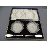 A CASED PAIR OF STAR-CUT BUTTER dishes with silver knives Sheffield 1963