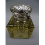 A FINE HEAVY GLASS INKWELL with 900 silver hinged and scrolled lid with band