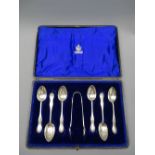 SILVER TEA SPOONS, a cased set of 6 with tongs all with decorative beadwork handles, 5 ounces