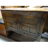 GOOD CARVED JACOBEAN REVIVAL CUPBOARD, with two doors, lunette carving and foliate carving, 98cms