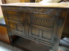 GOOD CARVED JACOBEAN REVIVAL CUPBOARD, with two doors, lunette carving and foliate carving, 98cms