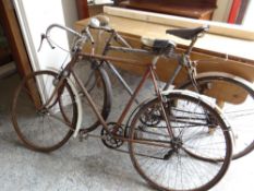 TWO MID-CENTURY RACING BICYCLES with drop handles, one with Olympic leather saddle (both distressed)