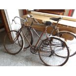 TWO MID-CENTURY RACING BICYCLES with drop handles, one with Olympic leather saddle (both distressed)