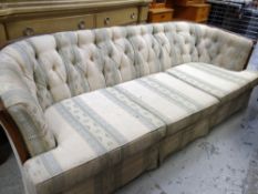 ANTIQUE THREE-SEATER CURVE BACK SOFA with buttoned, striped upholstery, 218cms wide